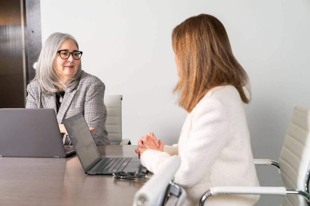 Lisa and Nancy discussing a strategy