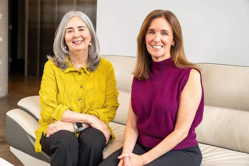 Lisa and Nancy sitting on a couch