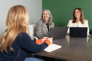 Nancy and Lisa chatting with a client